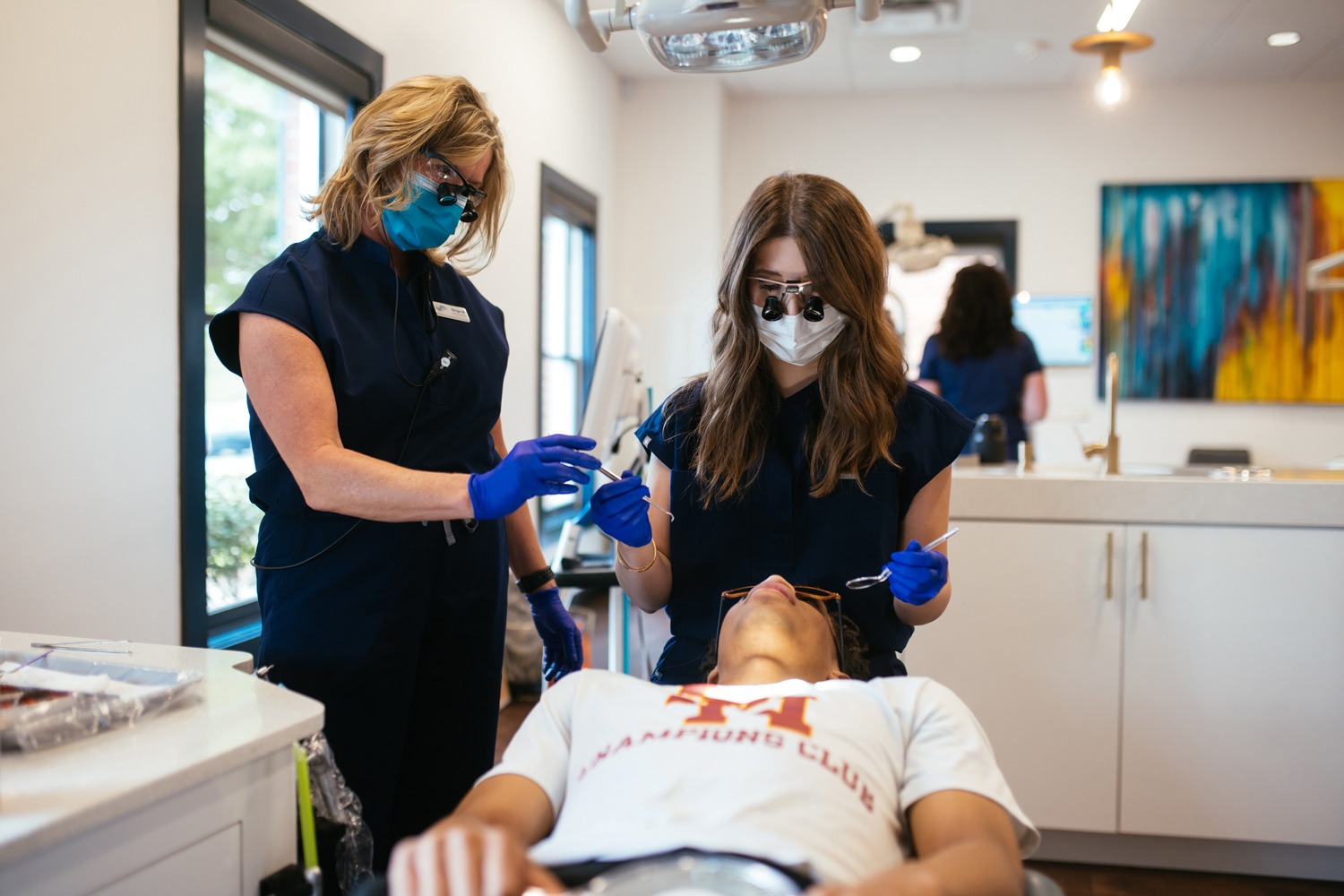 Orthodontic team providing crossbite treatment to teen patient in Johnson City, TN