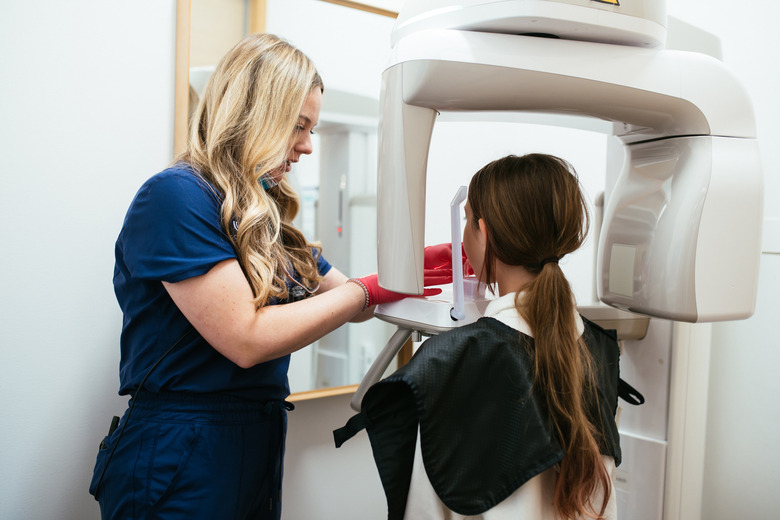 Patient receiving 3D digital imaging scan for underbite diagnosis at orthodontic office in Bristol, TN