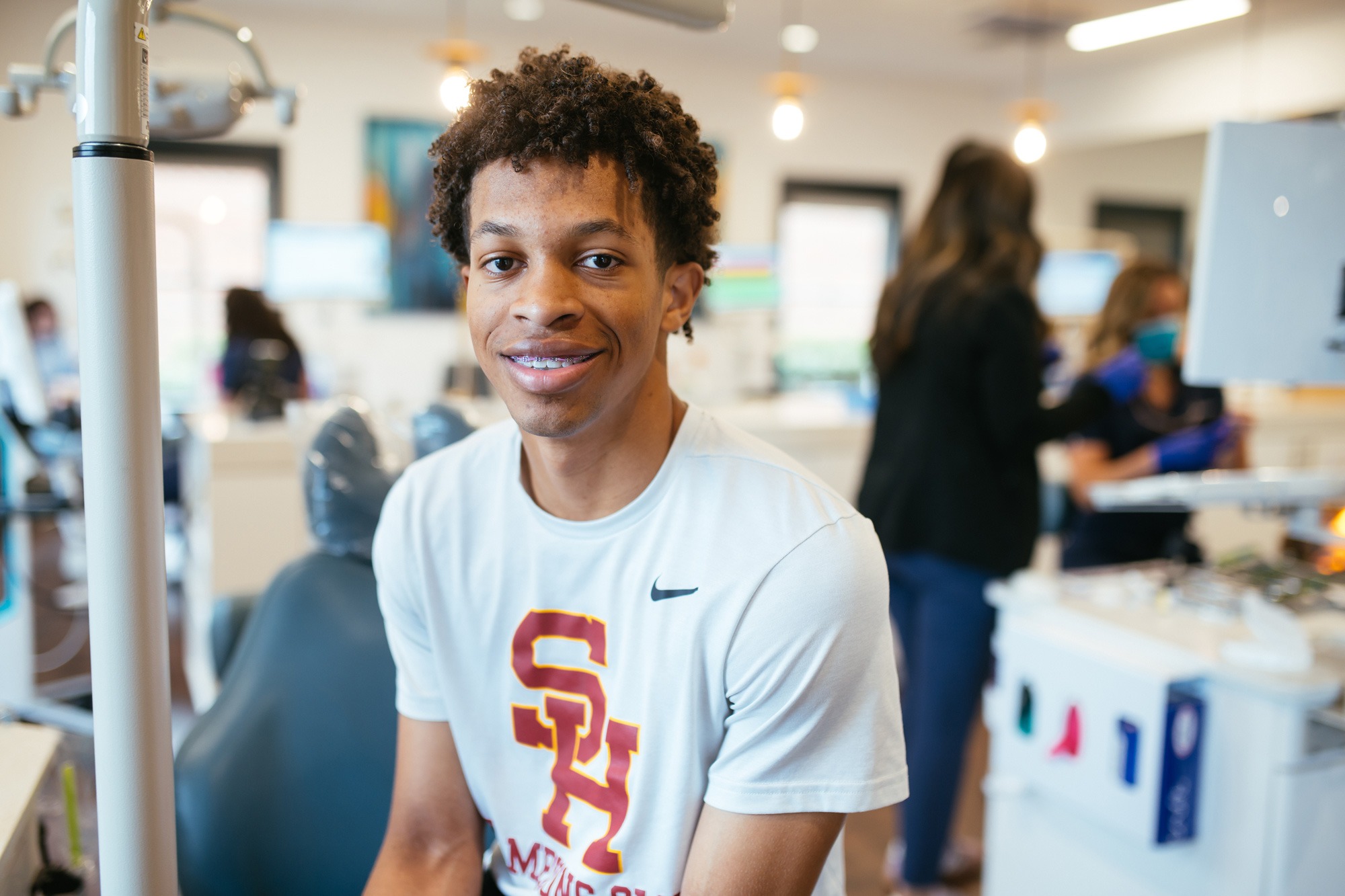 High school athlete wearing braces and Science Hill shirt at Sturgill Orthodontics in Johnson City, TN, smiling during an orthodontic appointment.