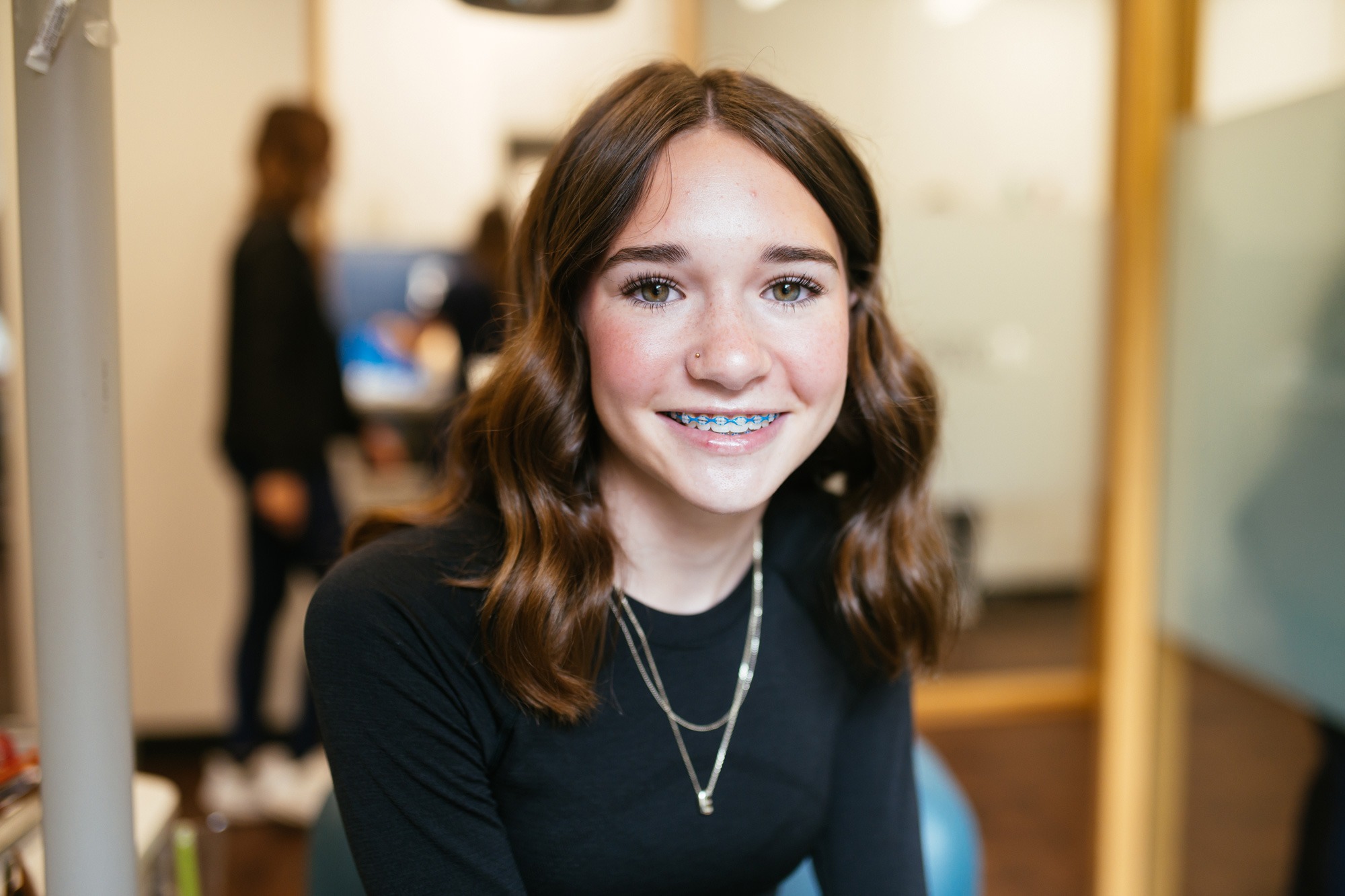 Teenage patient with blue braces smiling during an orthodontic appointment at Sturgill Orthodontics in Johnson City, TN.