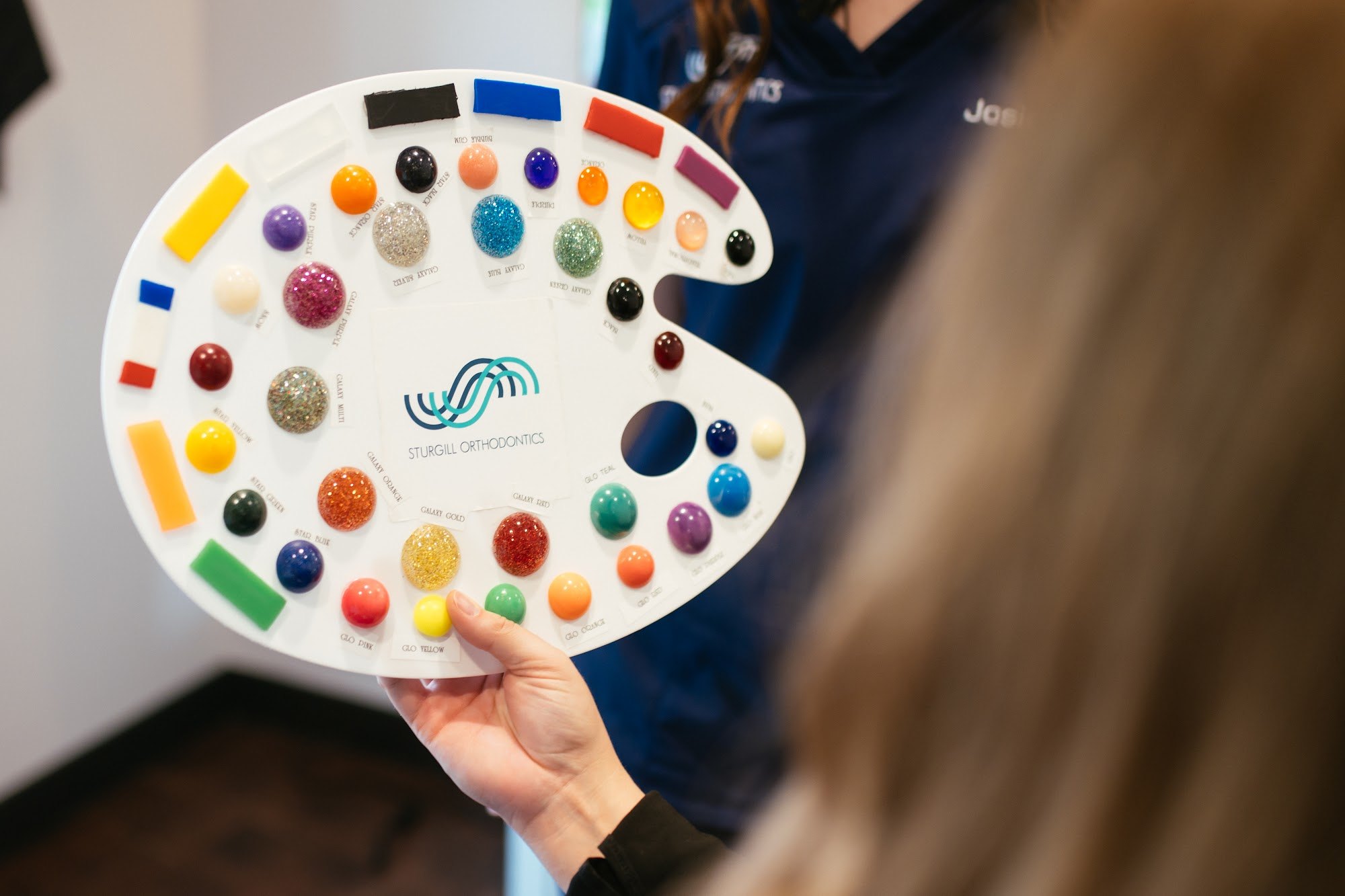 Palette of colored elastic samples for picking braces colors at Sturgill Orthodontics