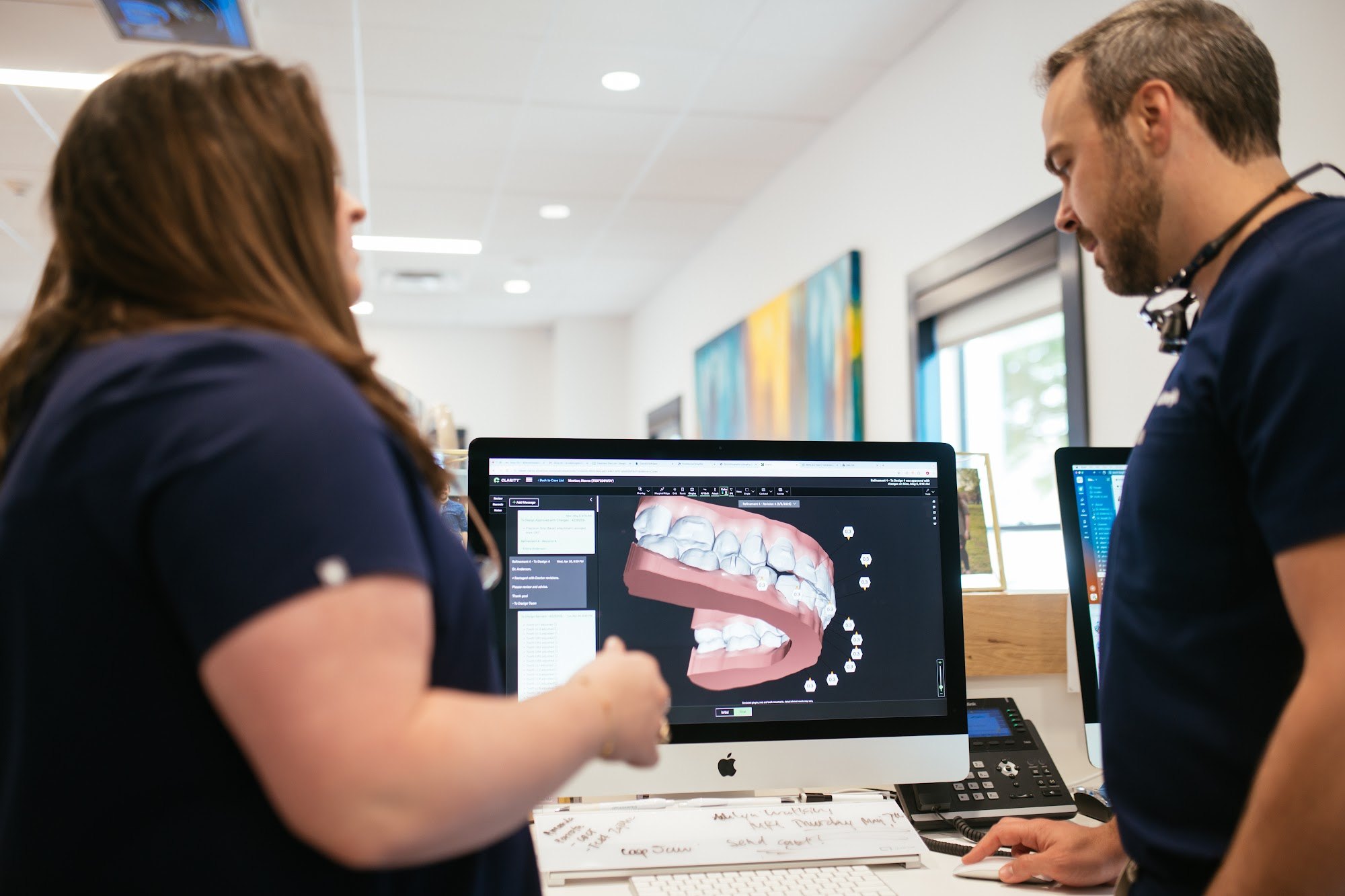 Sturgill Orthodontics team reviewing a patient's 3D teeth scan on a computer