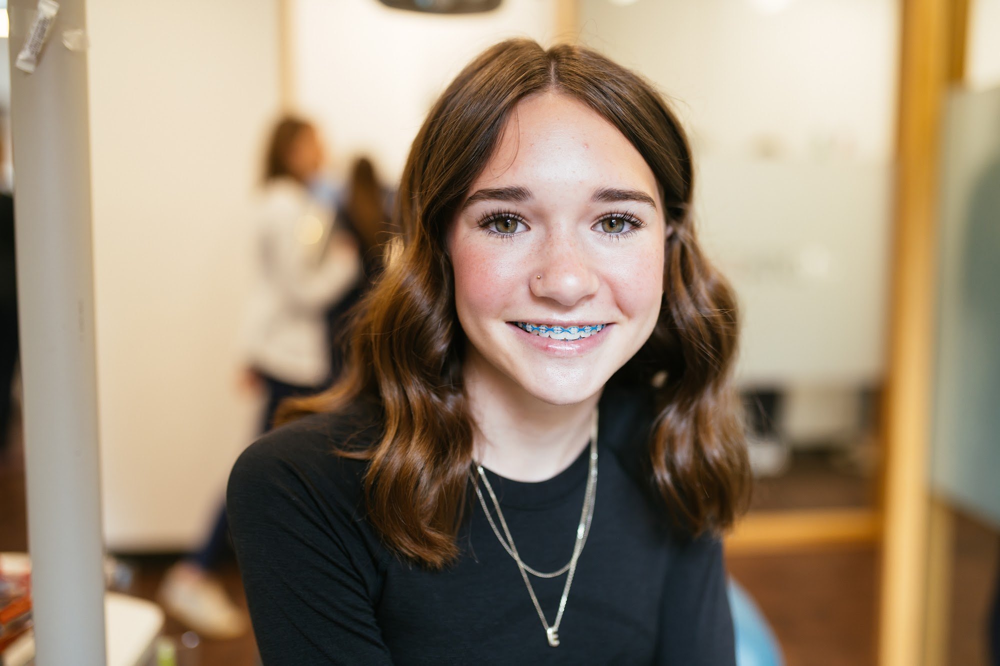 Teen girl smiling with metal braces at Sturgill Orthodontics